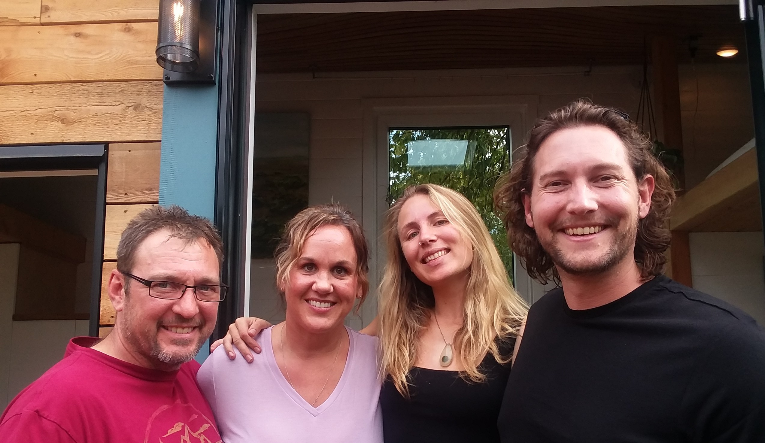 Jaimie and Dave from Highland & Co. Acres with Bryce and Rasa from Living Big in a Tiny House YouTube channel after filming shipping container home episode