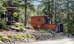 highland-acres-accommodations-shipping-container-tiny-home-forest-setting